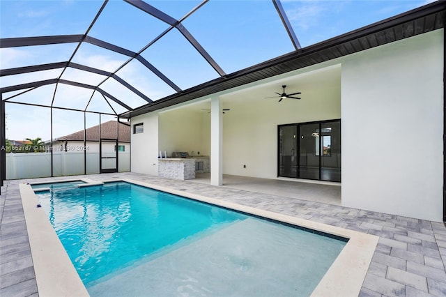 view of swimming pool with a lanai, a patio, and ceiling fan