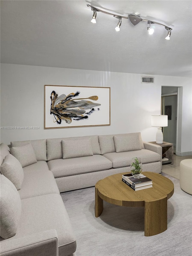 living room featuring visible vents