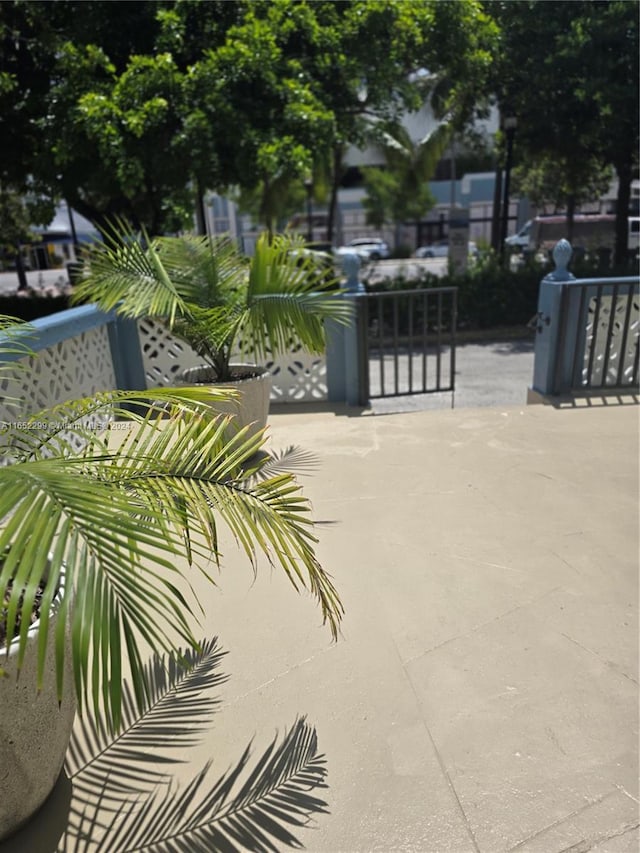 view of gate with a patio