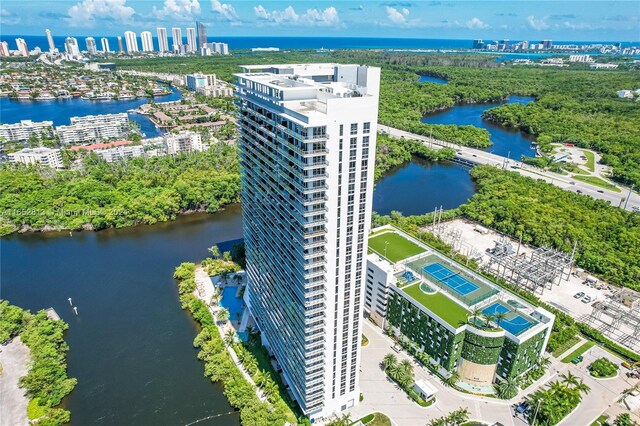 birds eye view of property with a water view