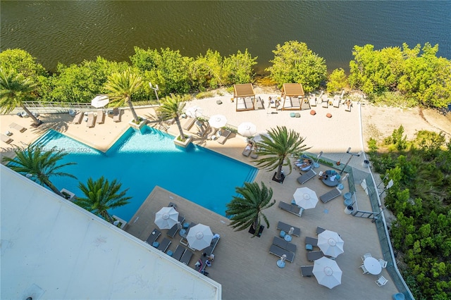 exterior space with a water view and a patio