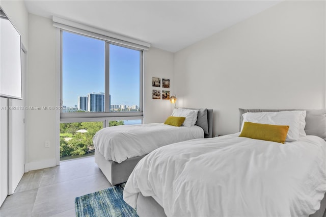 bedroom featuring expansive windows