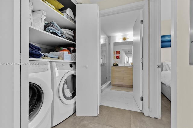 washroom featuring washing machine and dryer