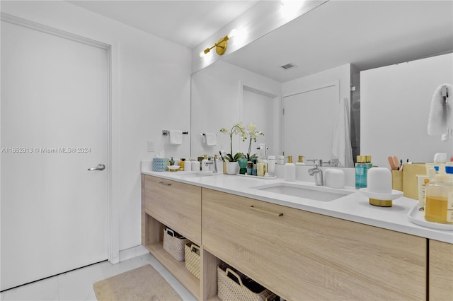 bathroom with vanity and tile patterned floors