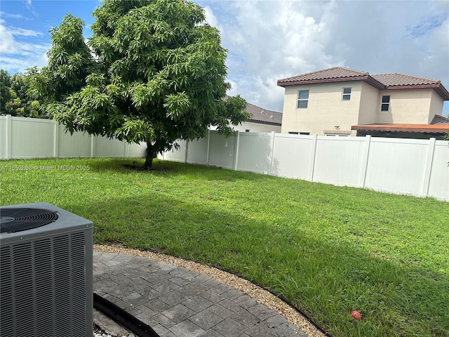 view of yard featuring central air condition unit