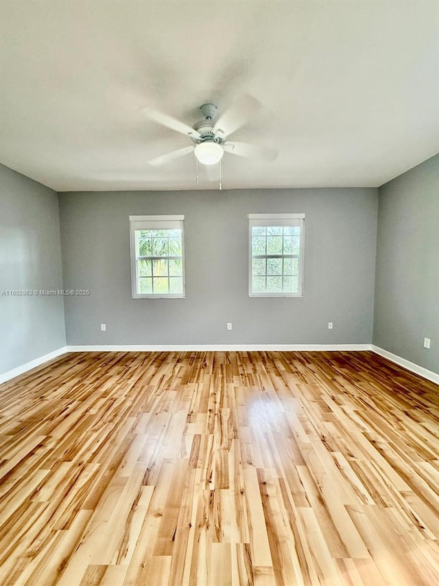 spare room with light hardwood / wood-style floors and ceiling fan