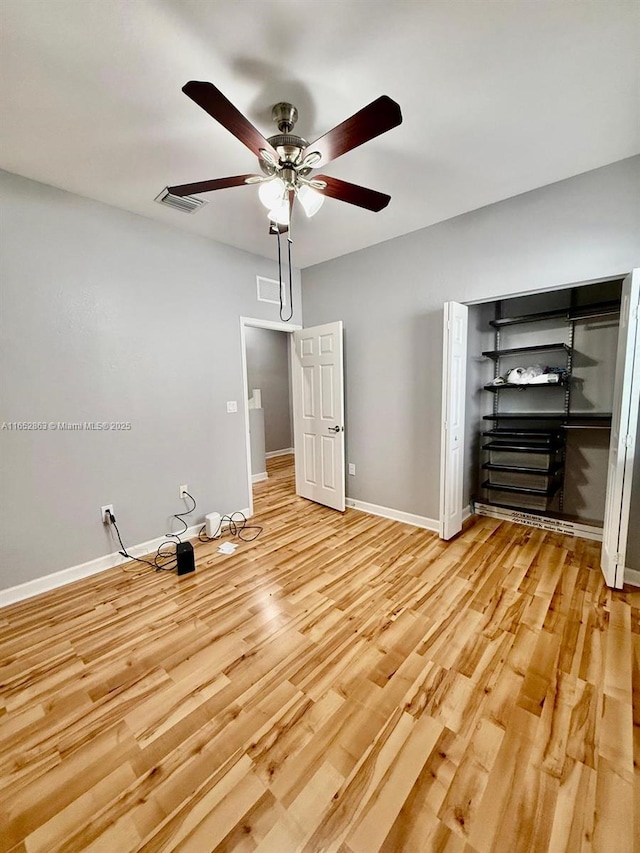 unfurnished bedroom featuring light hardwood / wood-style flooring and ceiling fan