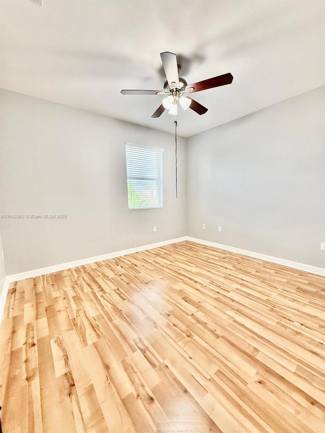 unfurnished room with ceiling fan and light wood-type flooring