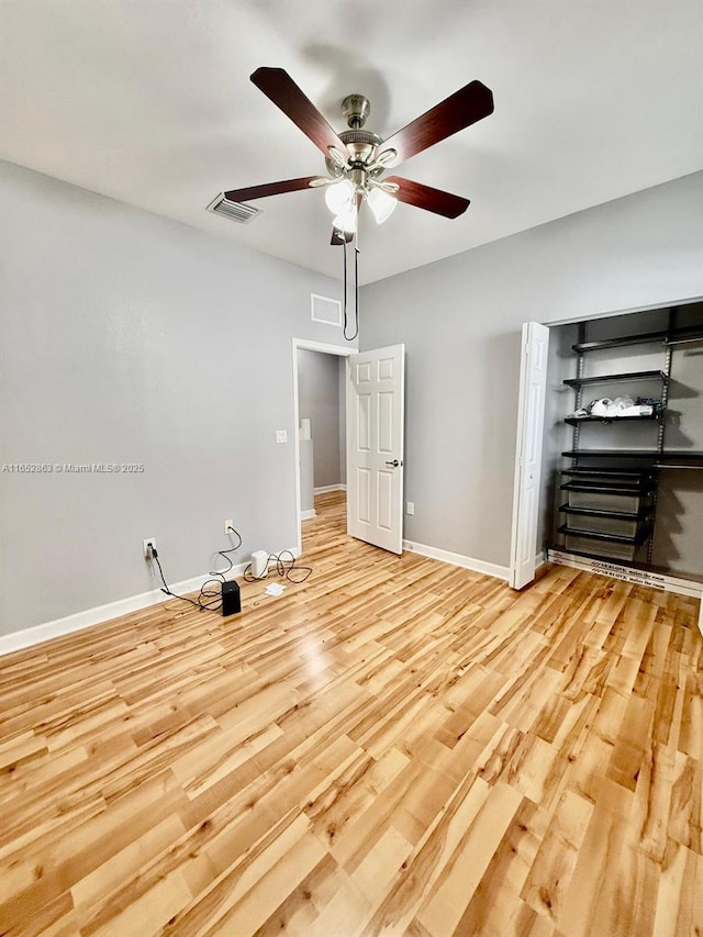 unfurnished bedroom with light hardwood / wood-style floors and ceiling fan