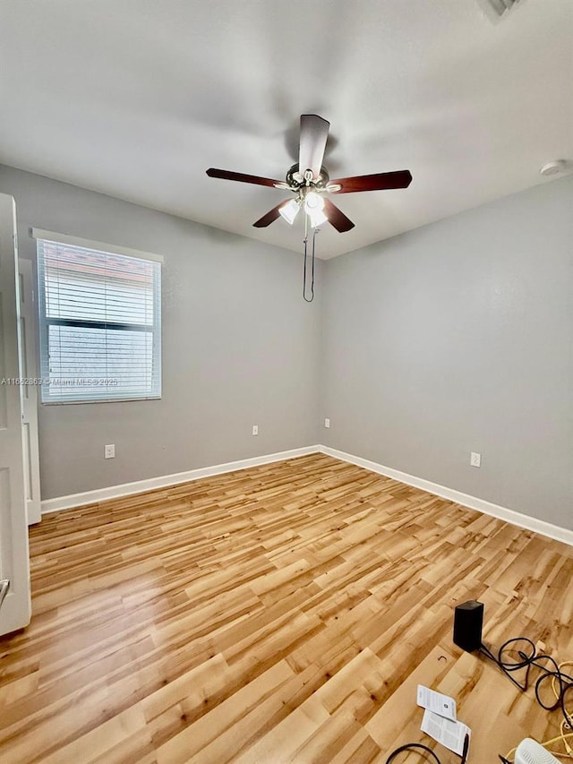 unfurnished room with ceiling fan and light hardwood / wood-style floors