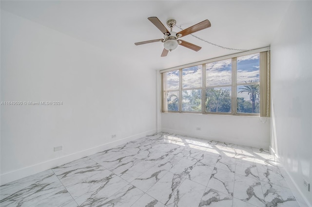 spare room with ceiling fan