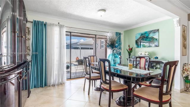 dining area featuring light tile patterned floors, a textured ceiling, and ornamental molding