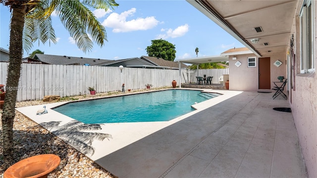 view of pool featuring a patio area