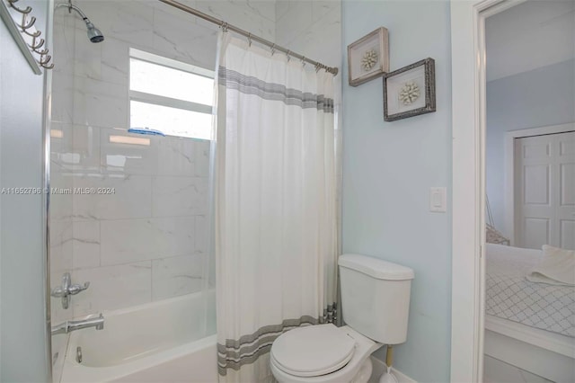 bathroom with toilet and shower / tub combo with curtain