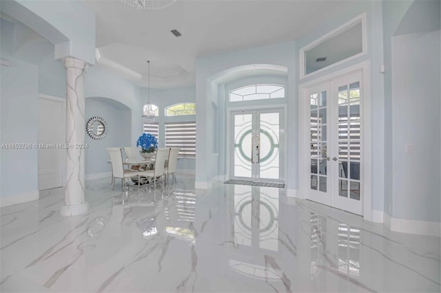 entrance foyer with french doors and ornate columns