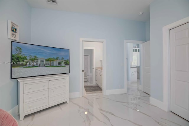 bedroom featuring ensuite bath