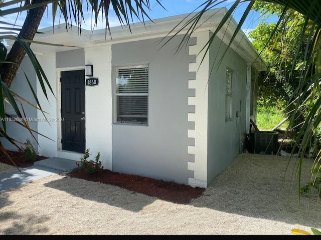 view of exterior entry featuring cooling unit