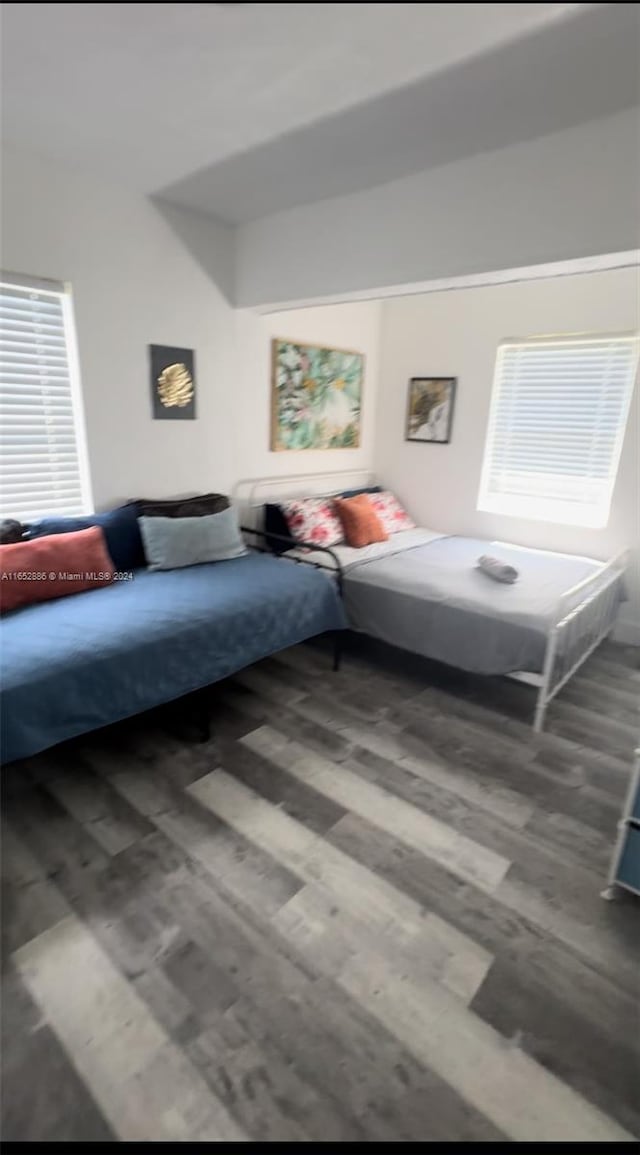 bedroom with hardwood / wood-style floors