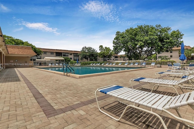 view of pool featuring a patio