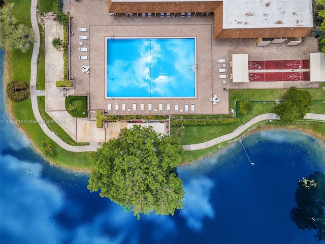 birds eye view of property with a water view