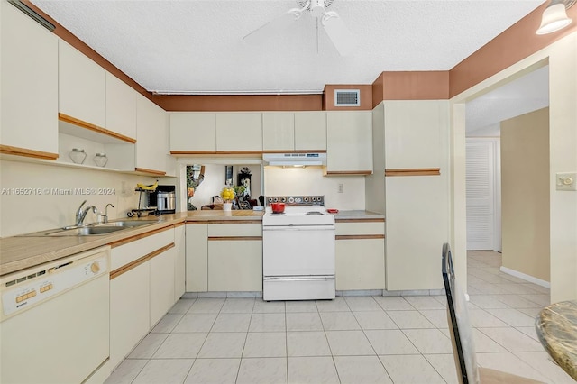 kitchen featuring white appliances, a textured ceiling, light tile patterned floors, sink, and ceiling fan