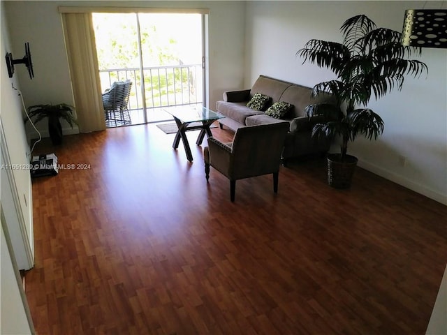 living room with dark hardwood / wood-style floors