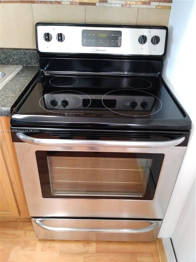 interior details featuring stainless steel electric stove