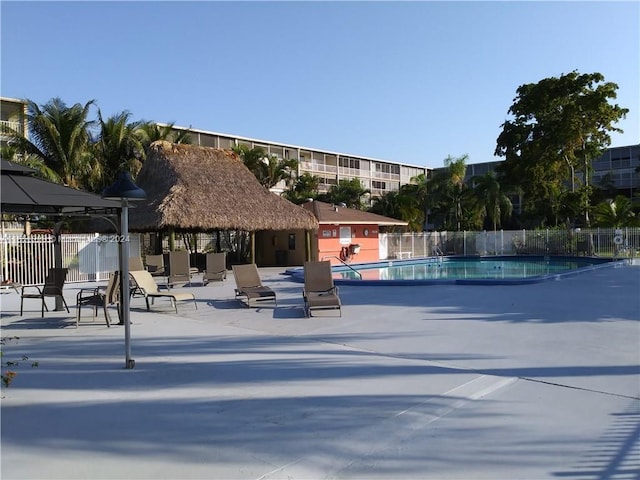 view of swimming pool with a gazebo and a patio area