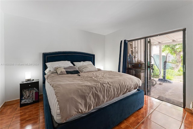 tiled bedroom featuring access to outside