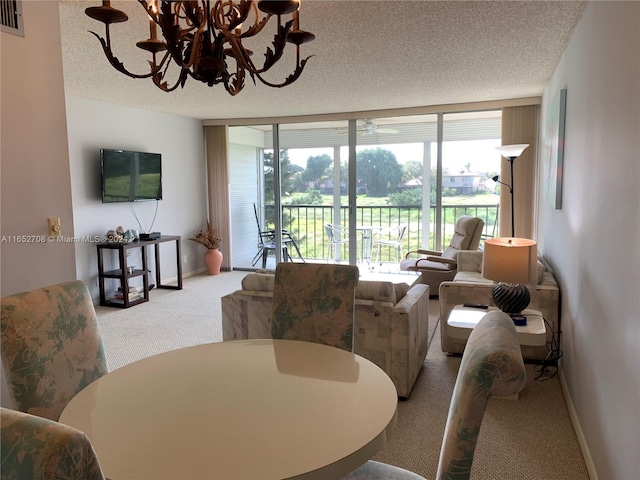 dining room with a wall of windows, a textured ceiling, a notable chandelier, and carpet flooring