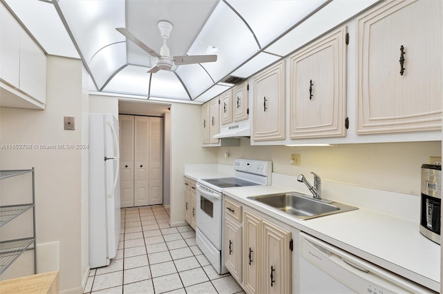 kitchen featuring white appliances, sink, light tile patterned flooring, and ceiling fan