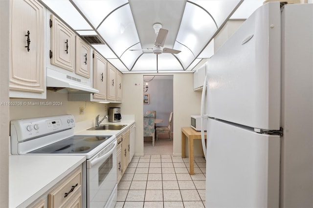 kitchen featuring white appliances, ceiling fan, light tile patterned flooring, and sink