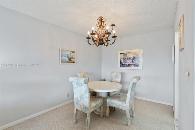 carpeted dining space with an inviting chandelier and a textured ceiling