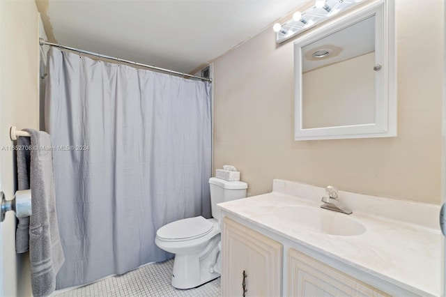 bathroom with vanity, toilet, walk in shower, and tile patterned floors