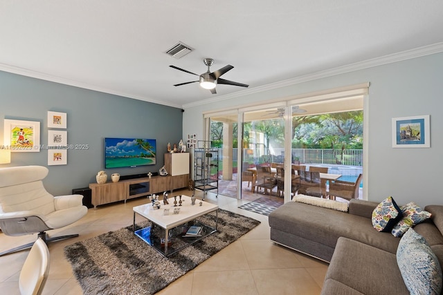 living area with ceiling fan, ornamental molding, visible vents, and tile patterned floors