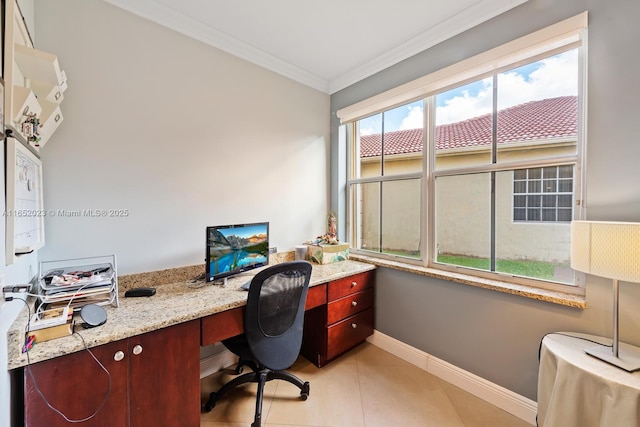 office space with ornamental molding, light tile patterned flooring, and baseboards