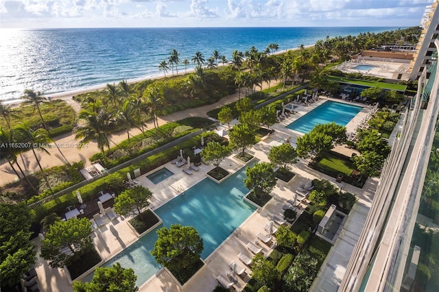 birds eye view of property featuring a view of the beach and a water view