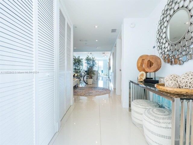 hallway featuring light tile patterned floors