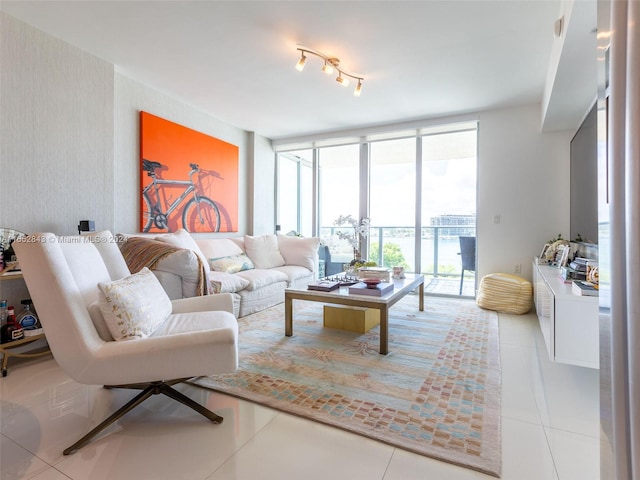 tiled living room featuring floor to ceiling windows