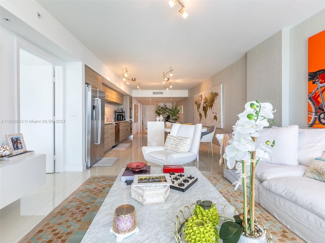 tiled living room with rail lighting