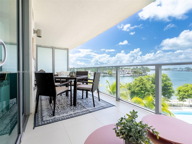 balcony featuring a water view