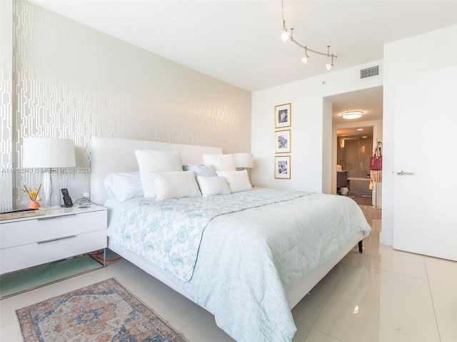 tiled bedroom with ensuite bathroom