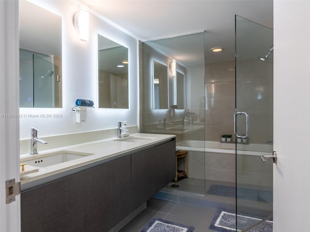 bathroom with tile patterned floors, separate shower and tub, and vanity