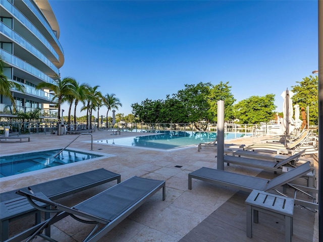 view of swimming pool with a patio area