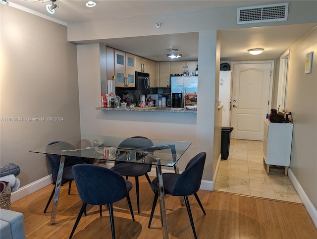 dining area featuring light hardwood / wood-style floors