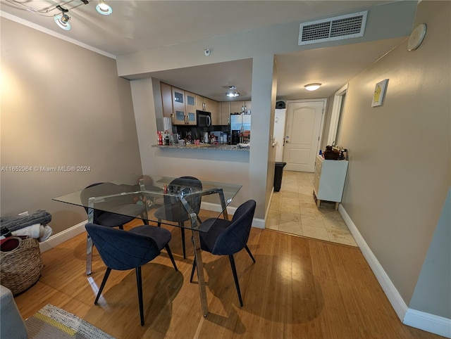 dining room featuring light wood-type flooring