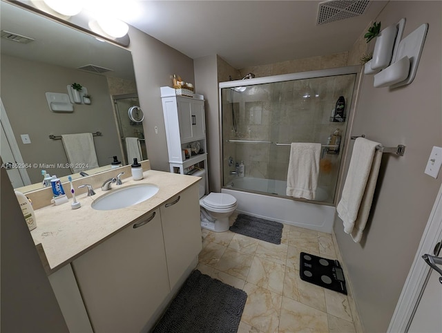 full bathroom featuring shower / bath combination with glass door, vanity, and toilet