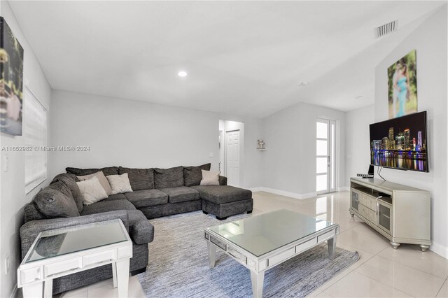 living room with light tile patterned floors