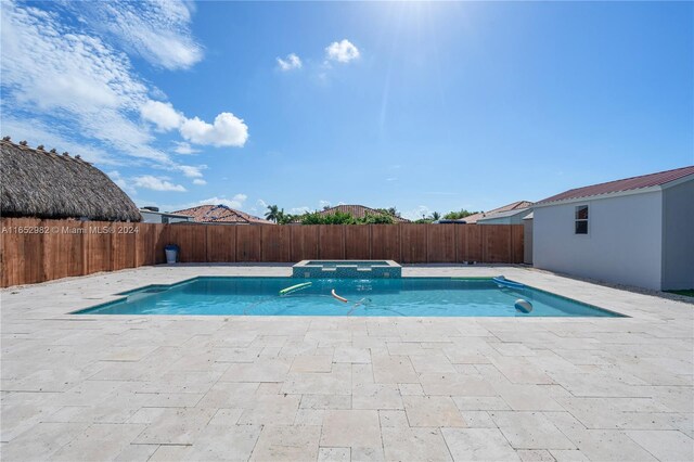 view of swimming pool featuring a patio area