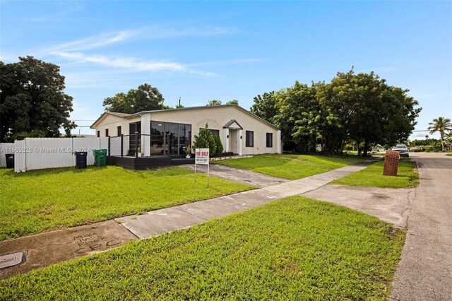 view of front of property with a front lawn